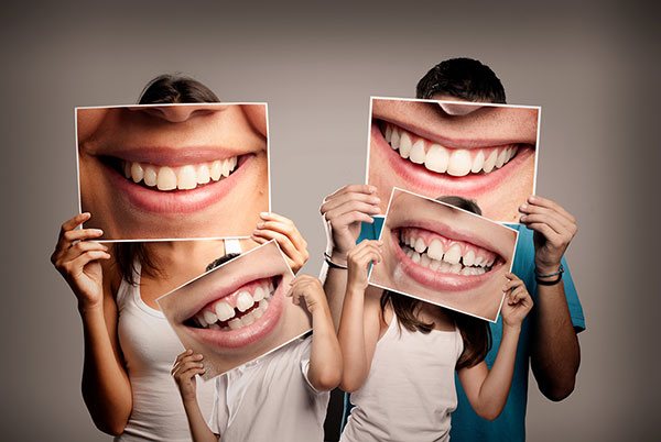 family hold healthy teeth pictures
